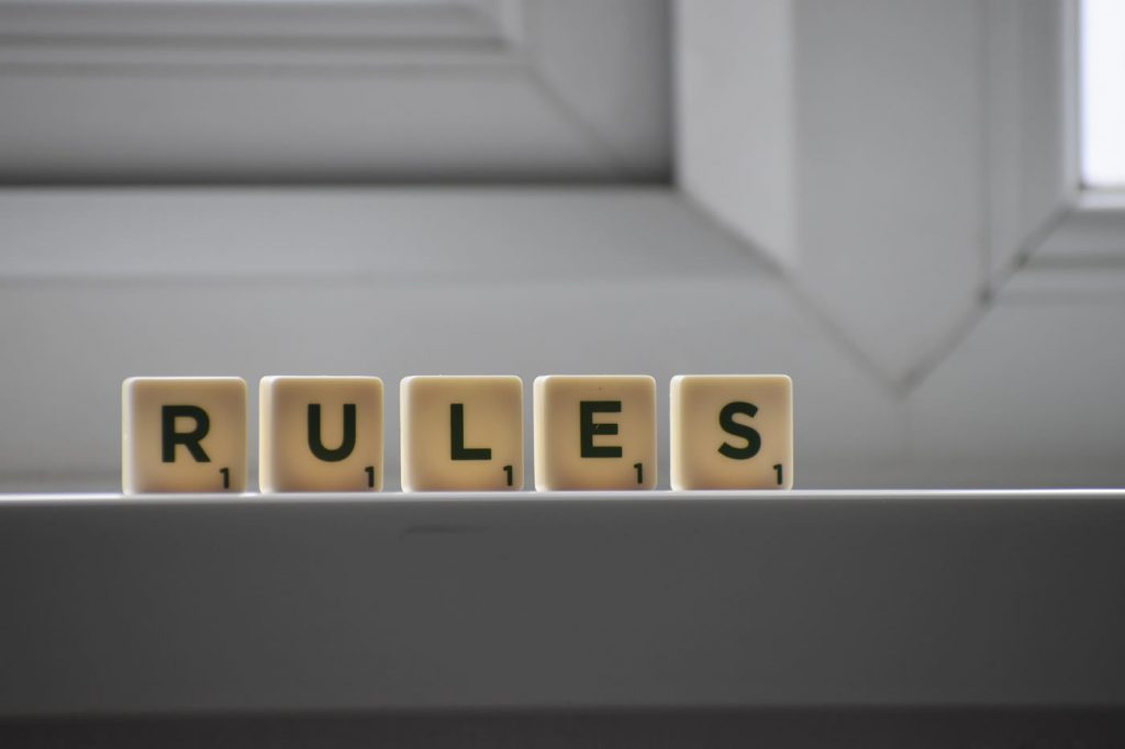 RULES spelt out with wooden blocks on a windowsill