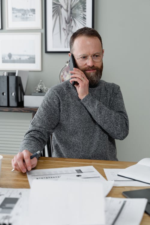 Man having a phone call while working at his desk
