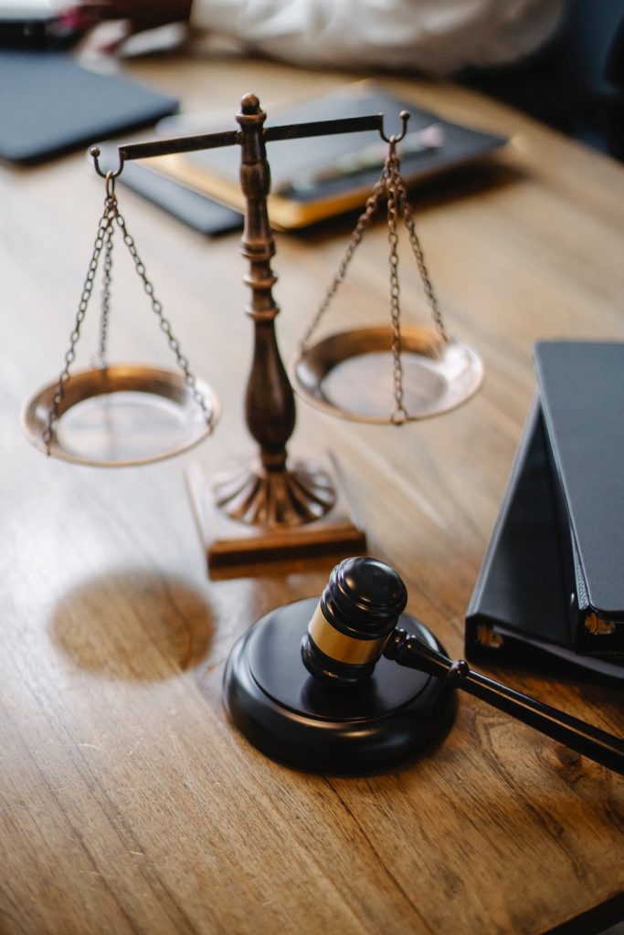 Weight scales next to a judge gabble on a wooden desk