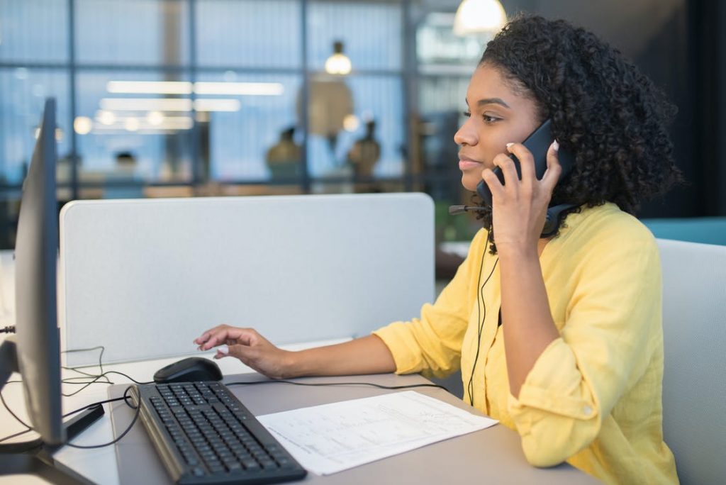 Woman answering a phone at a call center