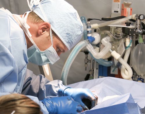 A surgeon operating on a patient