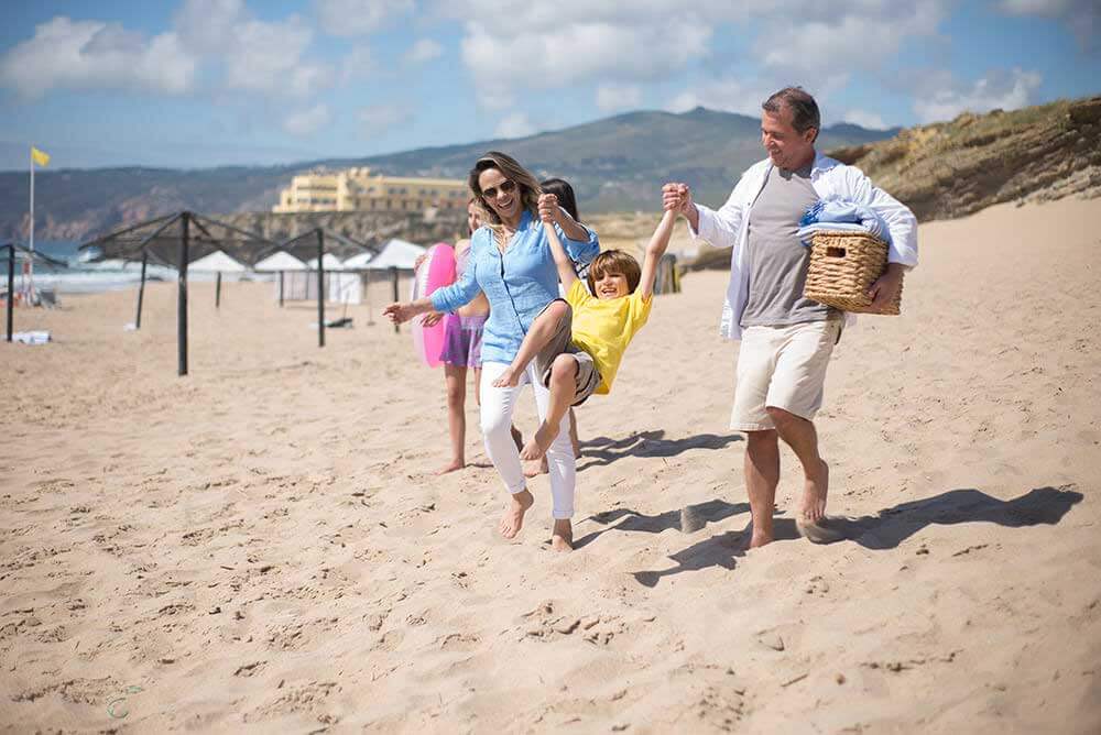 Family enjoying a day at the beach in the summer