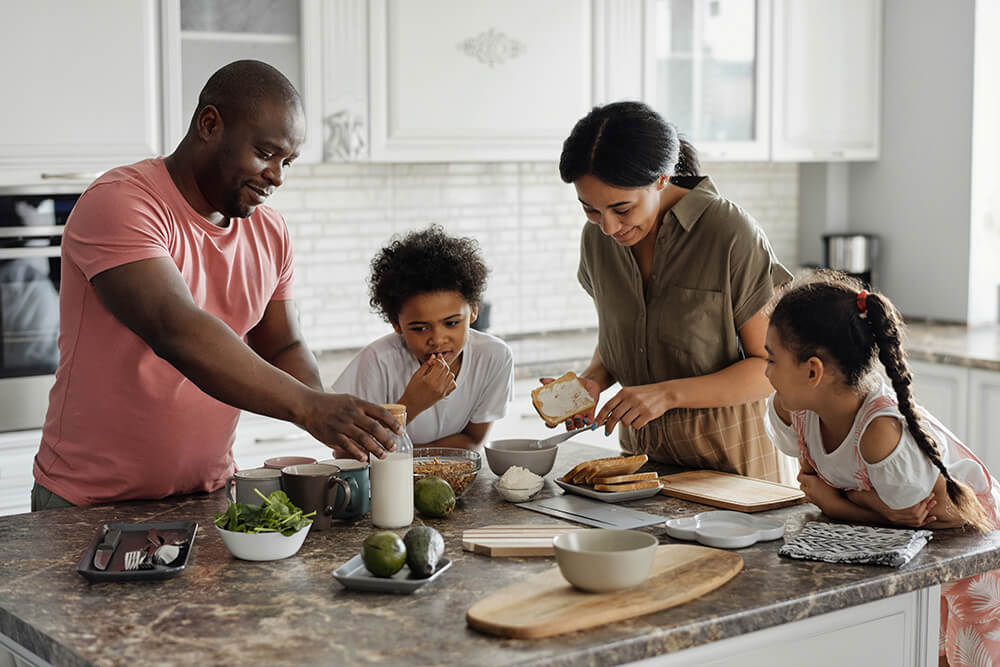 Family enjoying breakfast together in the kitchen